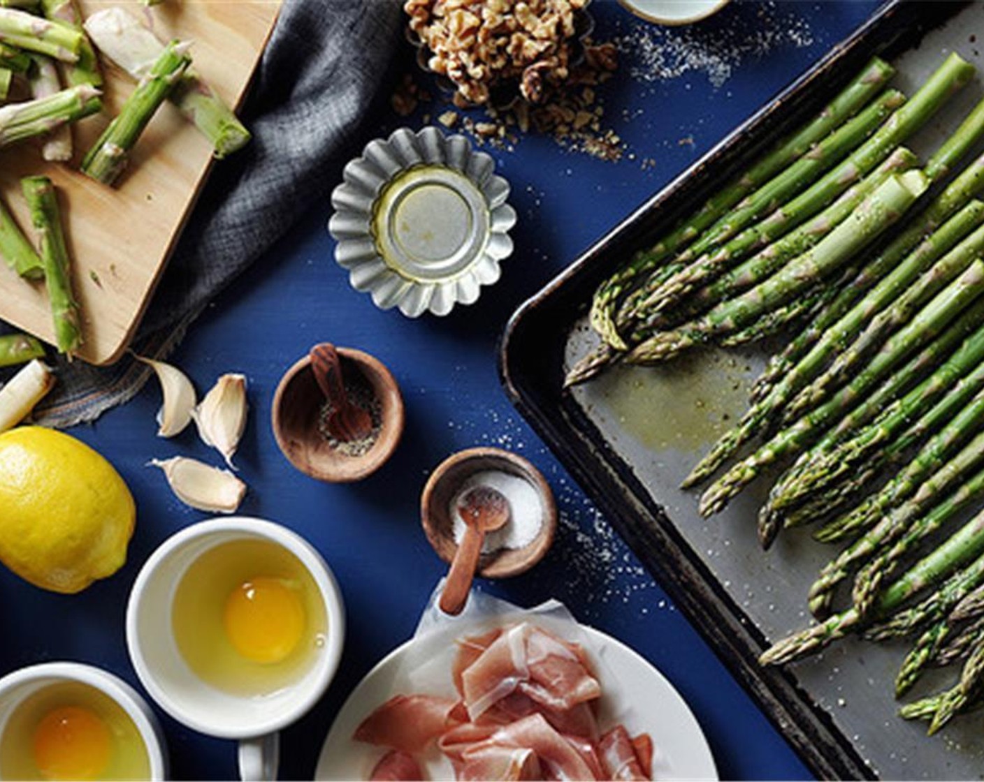 step 5 Place the Asparagus (6 1/2 cups) on a baking sheet, drizzle with Olive Oil (1 Tbsp), season with Salt (1/2 tsp) and Ground Black Pepper (1/2 tsp). Toss to combine and evenly coat.