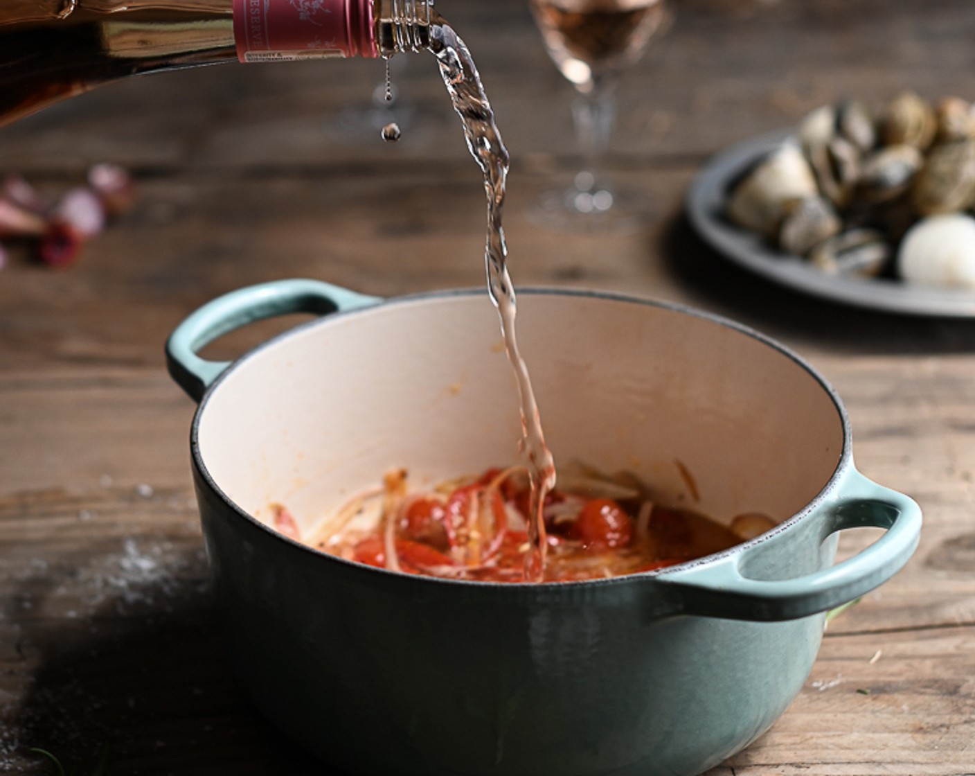 step 3 Pour in the Rosé Wine (1 cup) to deglaze the dish and season Salt (to taste) and Ground Black Pepper (to taste).