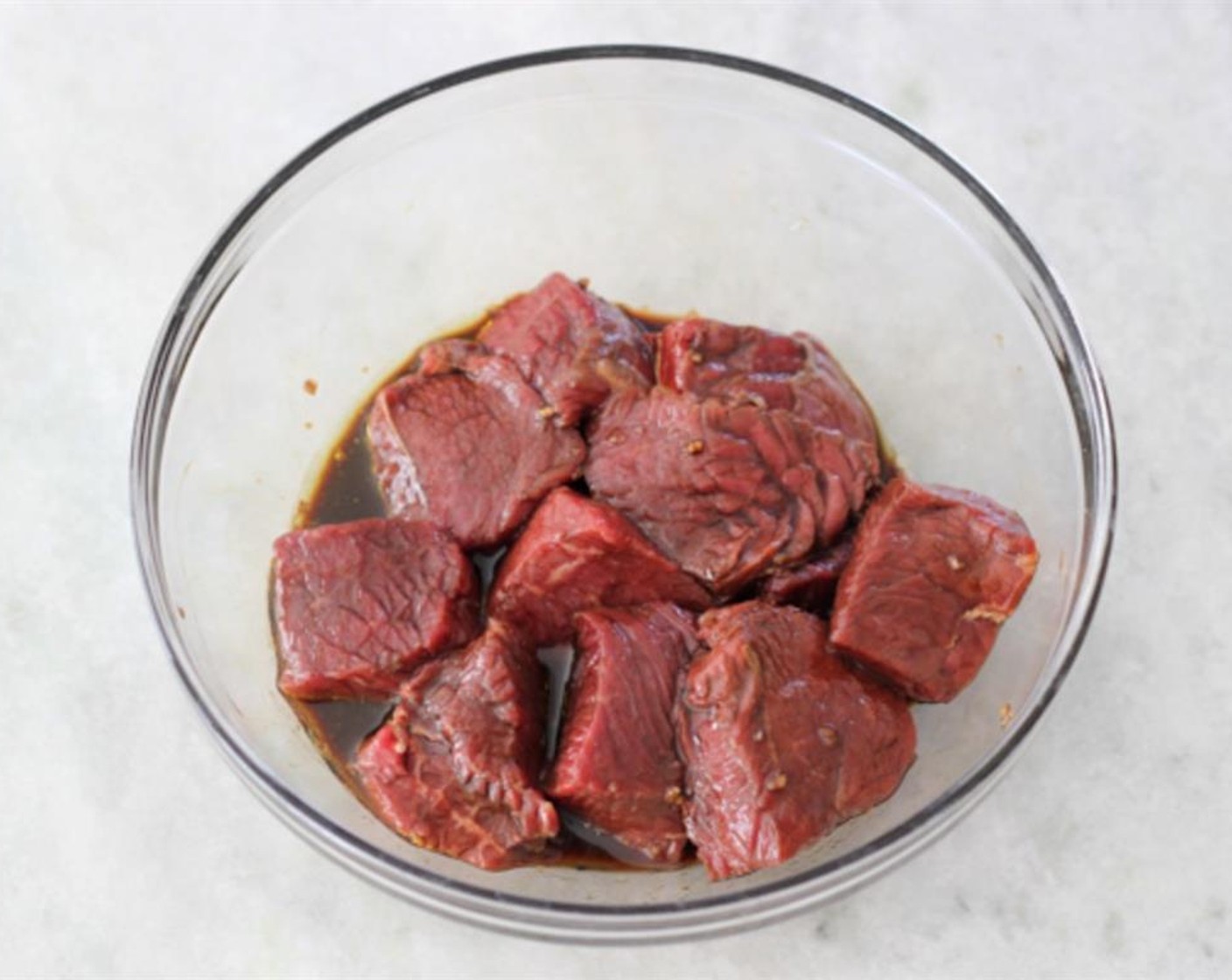 step 1 Add Soy Sauce (1 Tbsp), Balsamic Vinegar (1 tsp), Red Wine (1 Tbsp), Worcestershire Sauce (1 tsp), Garlic (2 cloves), Olive Oil (2 Tbsp), Salt (to taste), and Ground Black Pepper (to taste) to a mixing bowl. Add the Beef (1 lb) and let marinade.