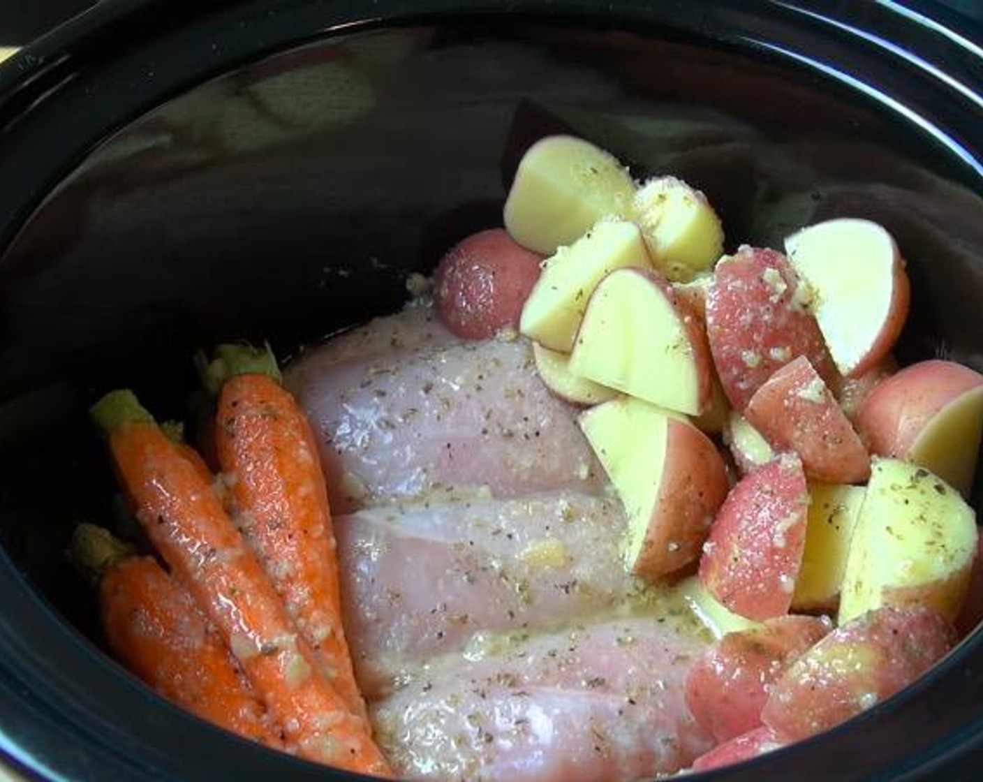 step 2 In a slow cooker, add Chicken Breasts (2.2 lb), Red Potatoes (4 cups) and Baby Carrots (2 cups). Pour the marinade mixture over everything. Cover and cook on high for 4 hours, or on low for 8 hours.