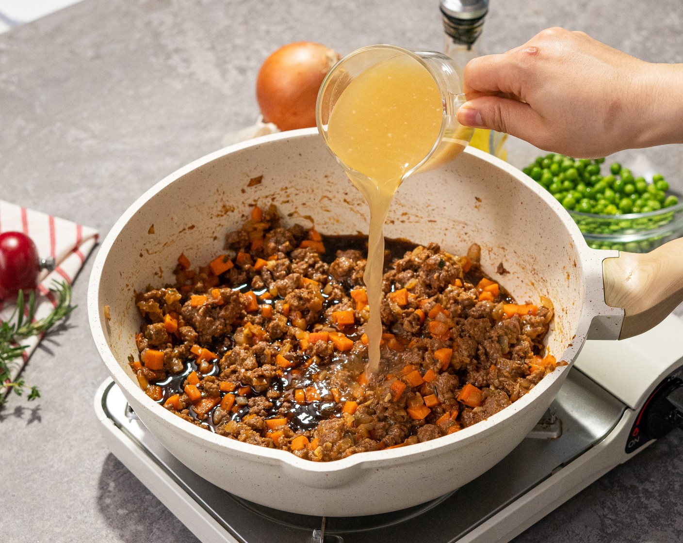 step 7 Add Stout Beer (1/2 cup), Beef Stock (1 cup), and Green Peas (3/4 cup). Reduce to low heat to simmer and cook until thickened. Stirring occasionally. Then season with Salt (1 tsp) and Ground Black Pepper (1 tsp).