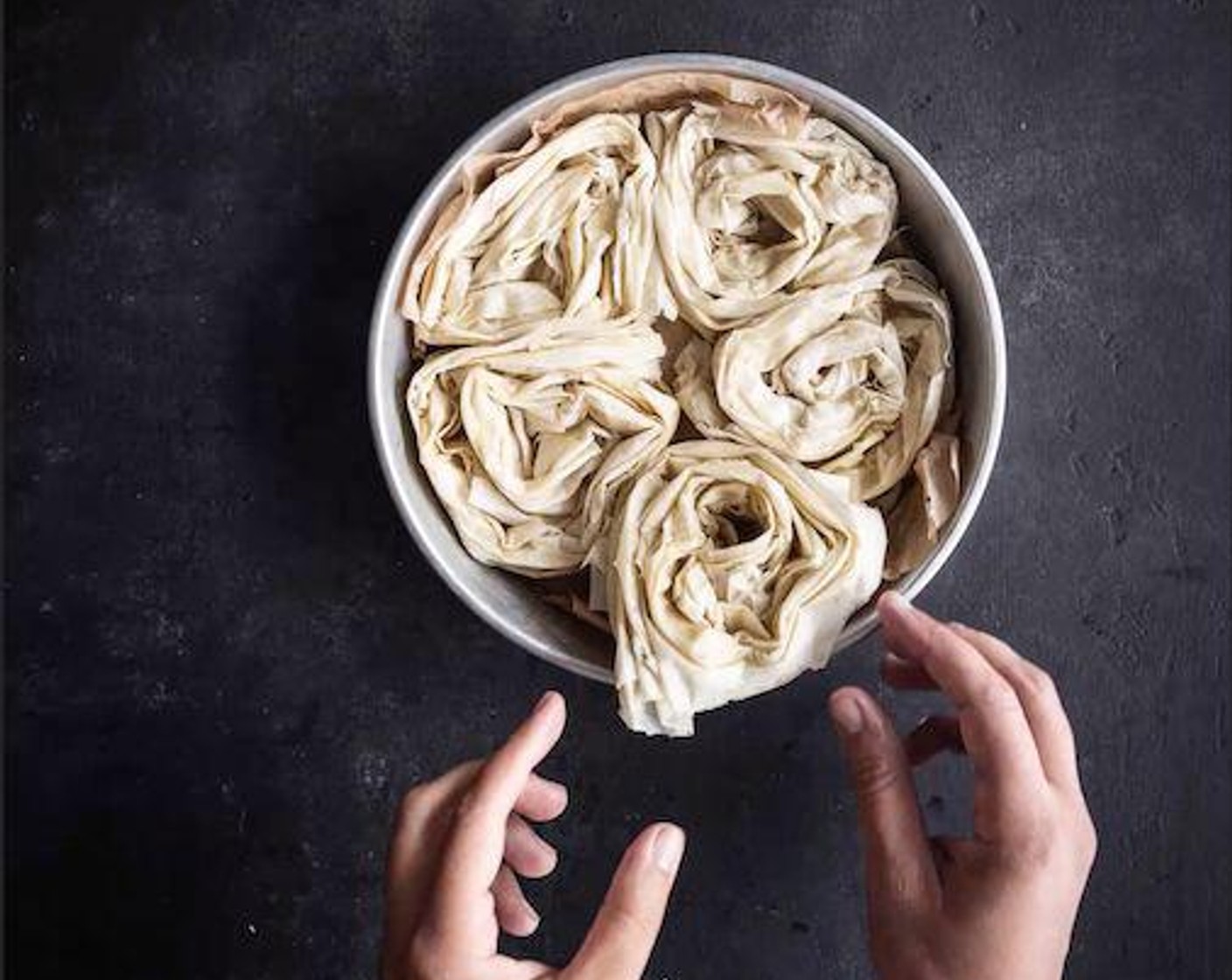 step 5 Brush the tops of the spirals with the remaining Butter (1 Tbsp). Bake in the preheated oven for 20-25 minutes, until the phyllo is golden brown.