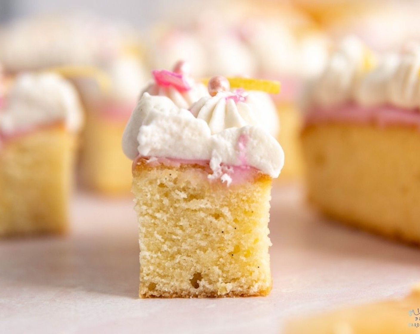 step 13 Spoon the whipped cream into a piping bag and pipe the whipped cream onto each cake. Decorate with grapefruit zest and Sprinkles (to taste). Enjoy!