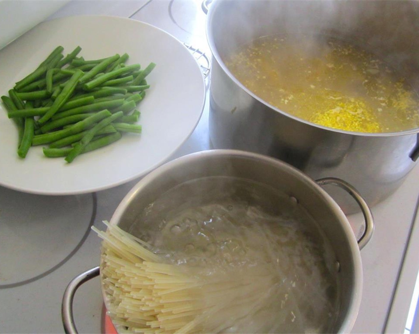 step 2 Meanwhile, blanch Green Beans (2 cups) and cook rice flour bucatini (2 handful).