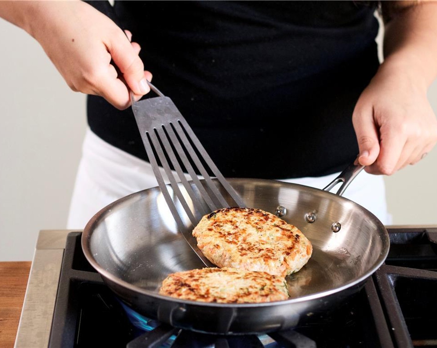 step 9 Add the turkey patties to the pan. Cook for 3 minutes on each side.