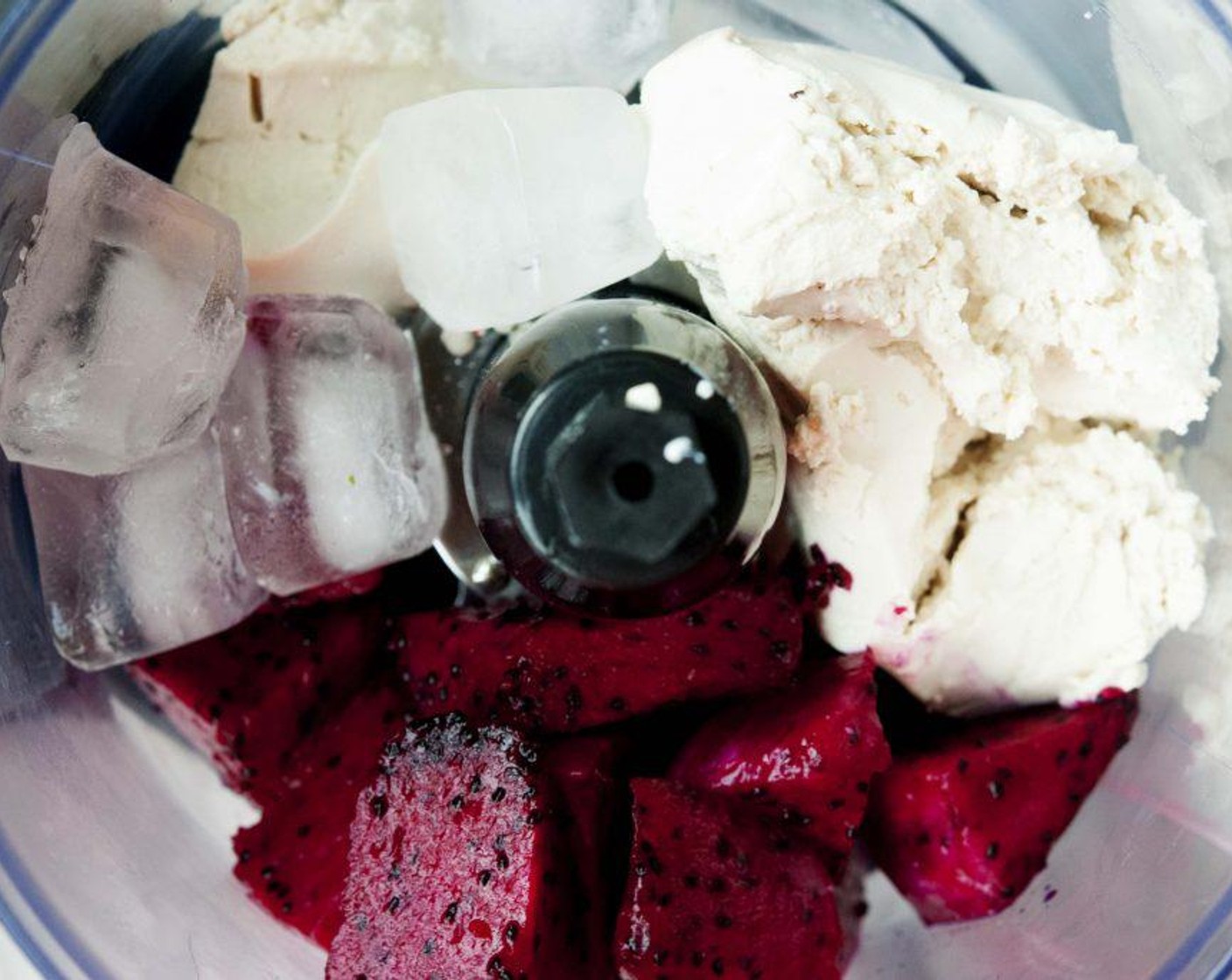 step 1 Place the Silken Tofu (7 oz) into cheesecloth and squeeze out any access water, then transfer into a food processor with the Dragon Fruit (1 cup) and Ice (to taste).