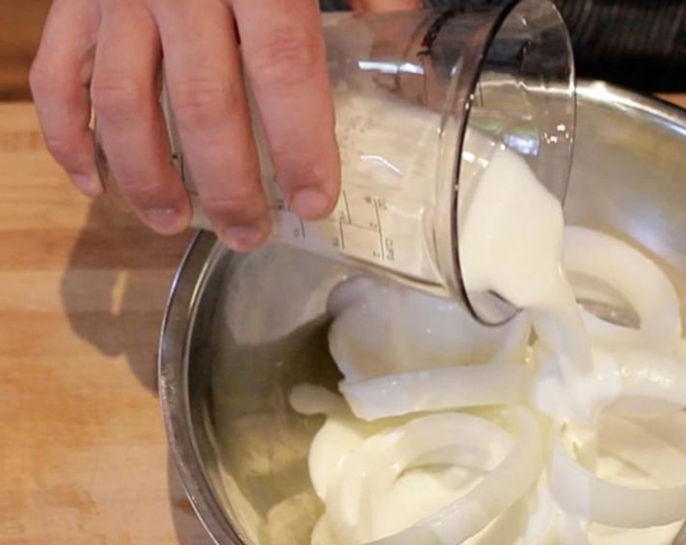 step 3 Select the 12 best rings, and place them in a bowl with  Buttermilk (to taste) and Seasoned Salt (2 tsp). Toss to combine, then arrange so that as much onion is submerged as possible. Chop the remaining (unsoaked) pieces of onion, and set them aside.