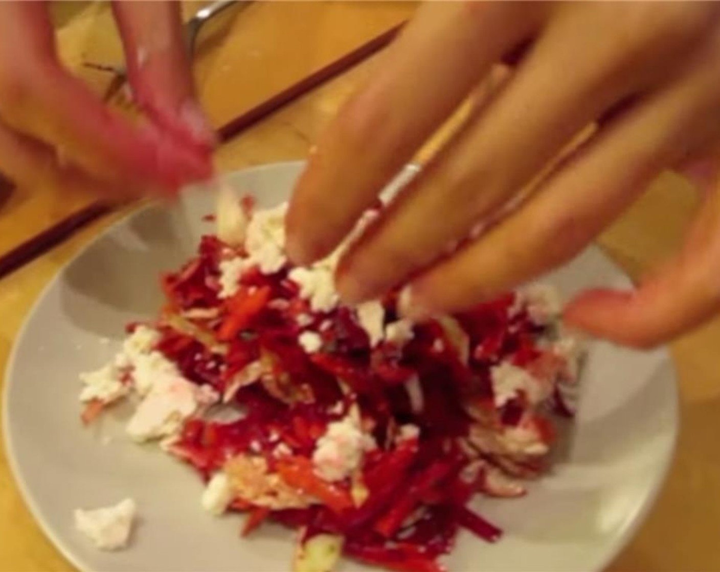 step 11 Plate salad onto serving plates and top with crumbled Feta Cheese (1 cup).