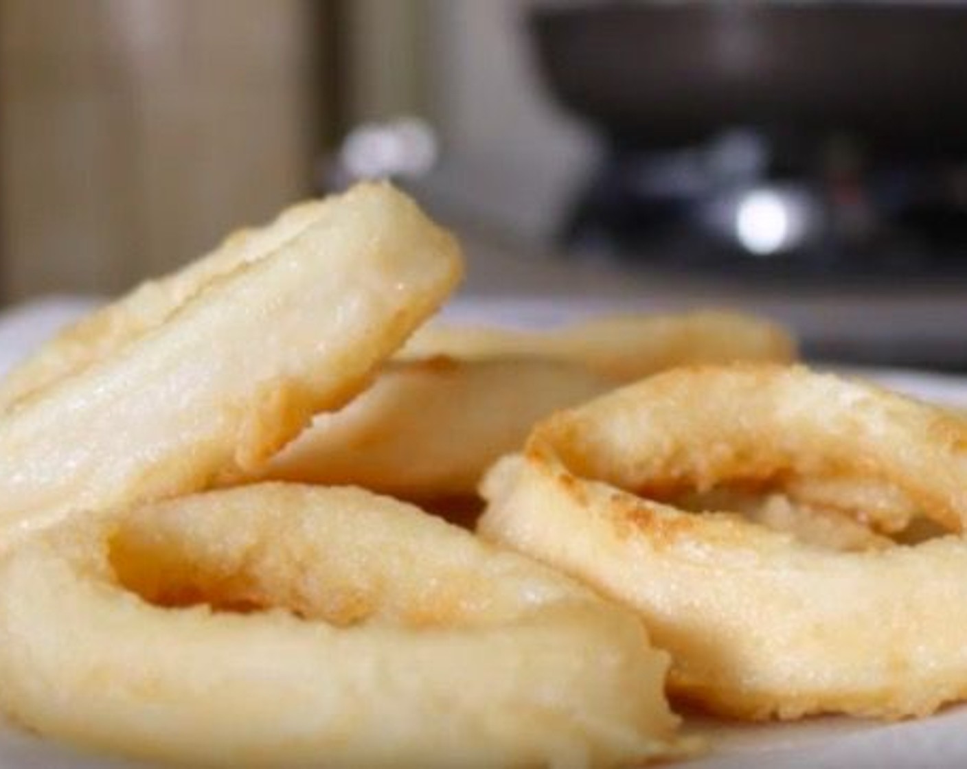 step 13 Add the squid rings and cook for 2 minutes per side, then transfer to a dish with paper towels.