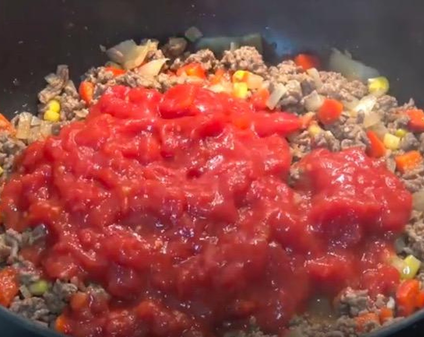 step 4 Add Canned Diced Tomatoes (1 3/4 cups). Reduce the temperature to low and allow to simmer for 5 minutes, or until the mixture thickens slightly. Season with Salt (to taste).