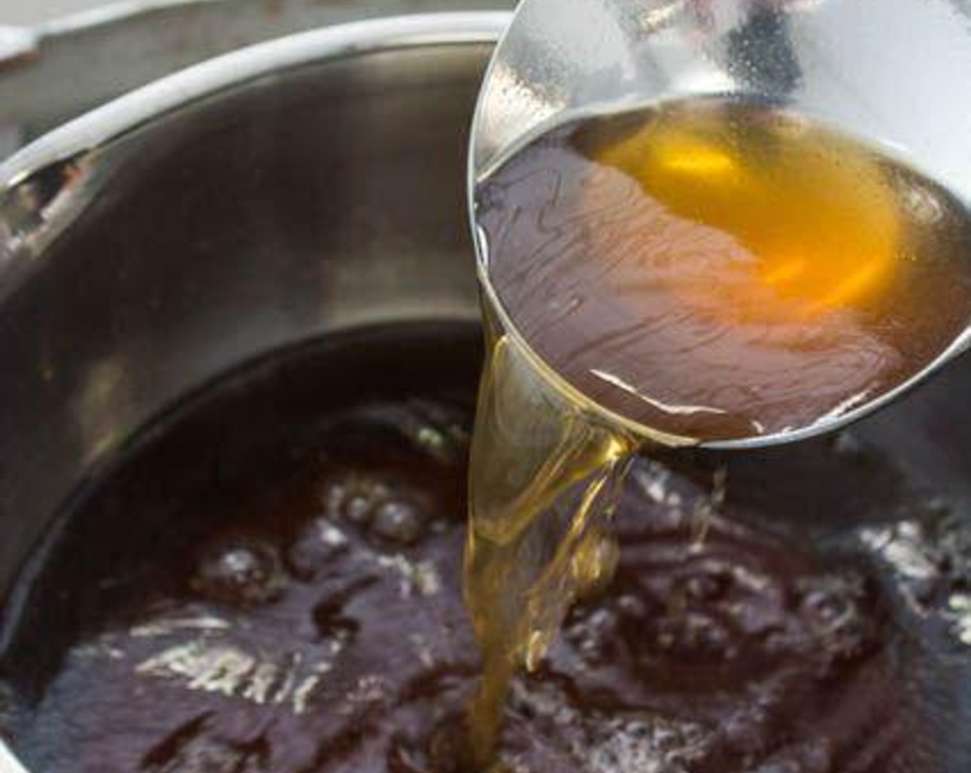 step 3 Put the Soy Sauce (1/2 cup) and Chicken Soup (5 cups) in a medium saucepan. Mix and bring to a simmer over low heat.