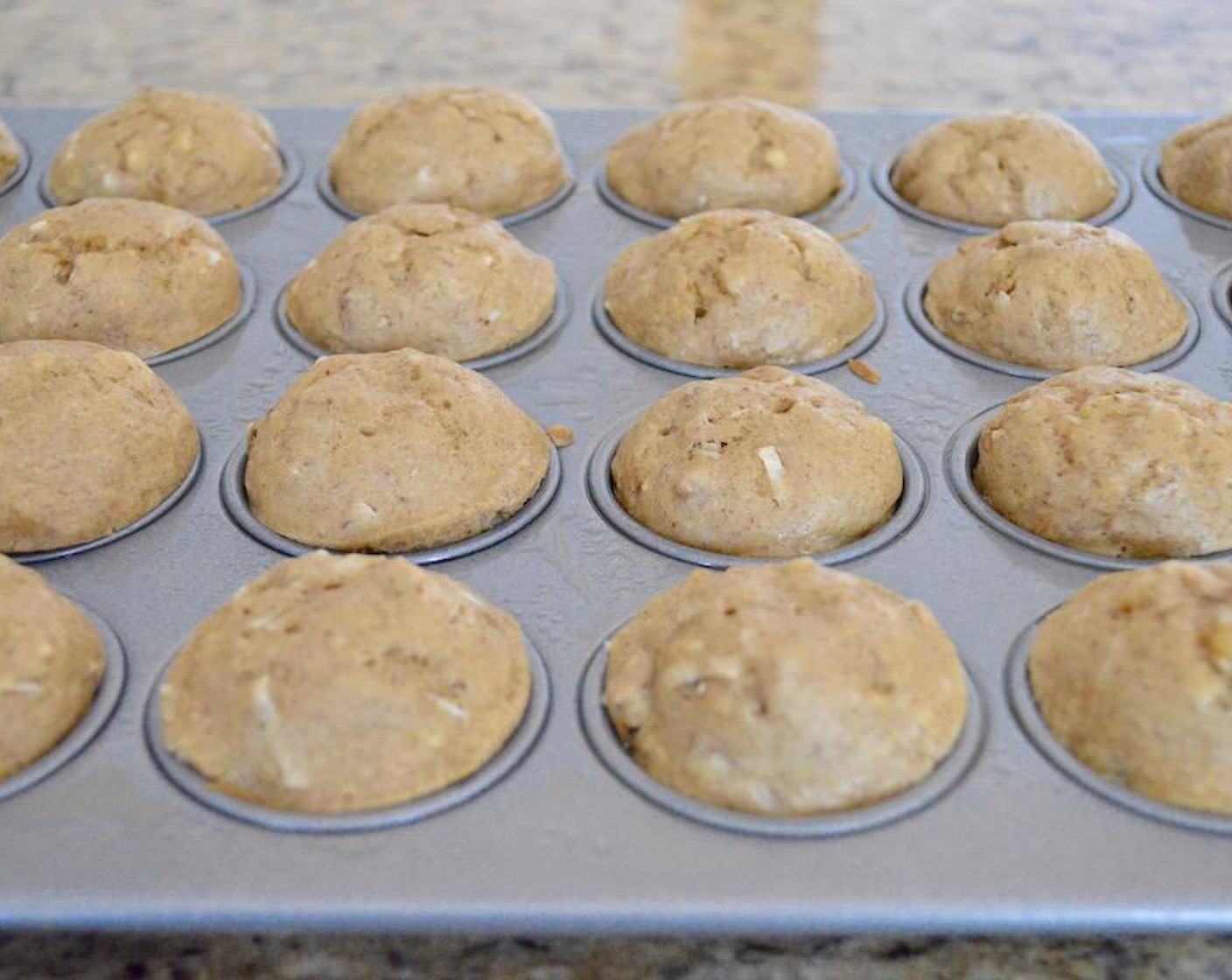 step 6 Let the muffins cool for 5 minutes, then turn the tin out onto a cooling rack to let them cool completely.