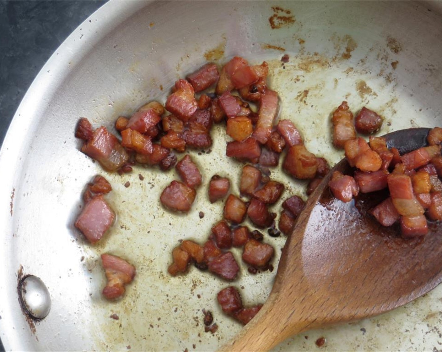 step 6 Meanwhile, heat remaining Olive Oil (1 Tbsp) in a small skillet over medium high heat. Add pancetta and cook until browned, stirring occasionally. Using a slotted spoon, transfer pancetta to a folded paper towel to drain.