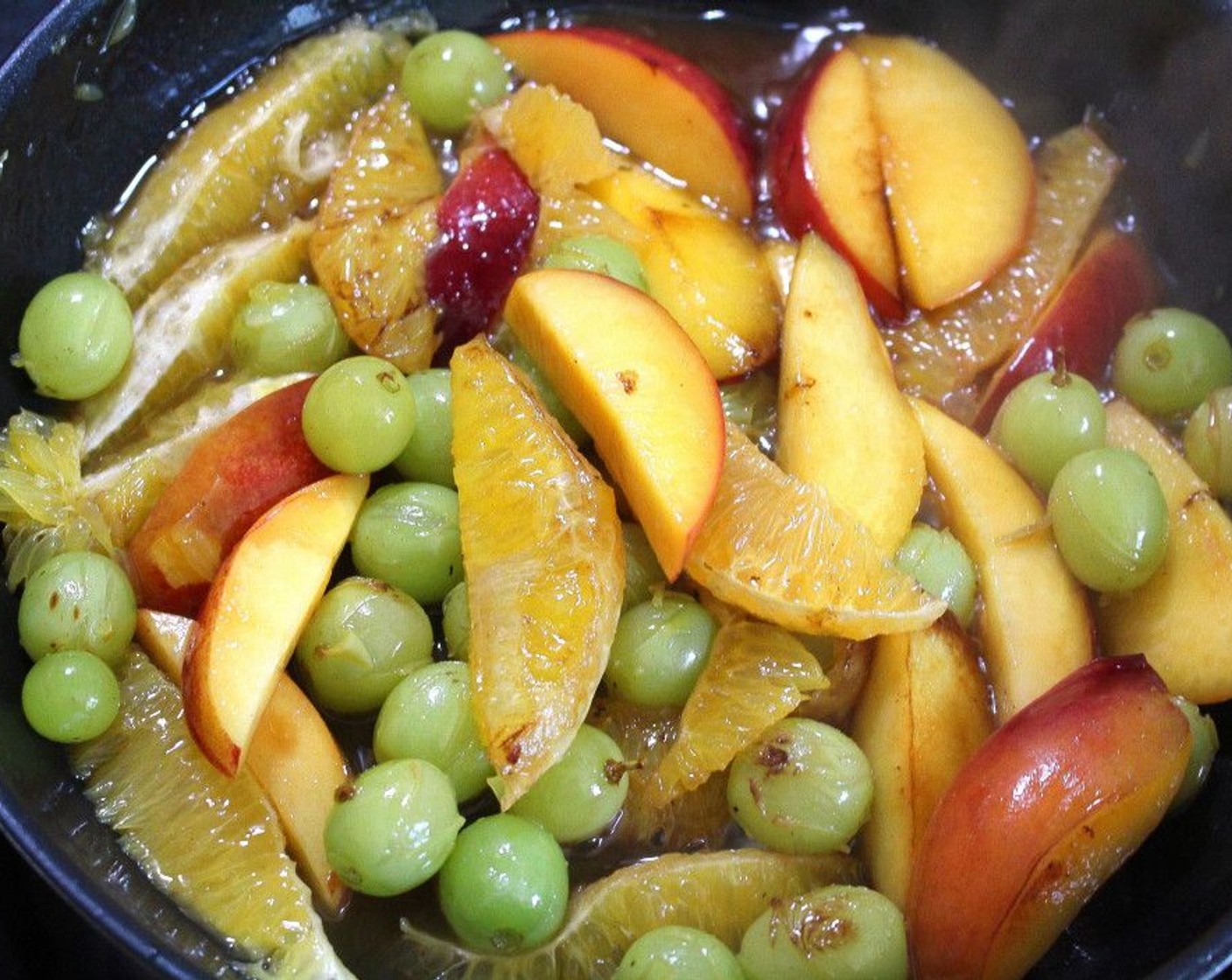 step 5 Add some of the Oranges (2), Apples (2), Grapes (to taste), and Granulated Sugar (to taste). Sauté until the fruits are lightly caramelized.