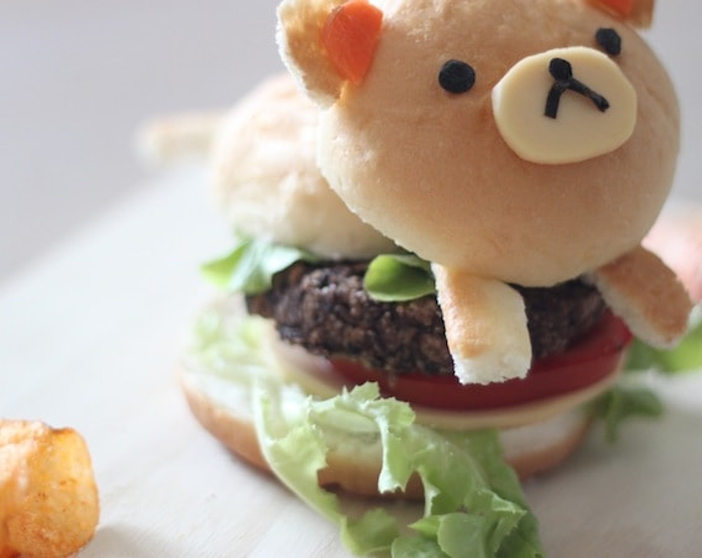 step 14 After adding all the layers, it's time for Rilakkuma to ride the burger. Serve and enjoy!