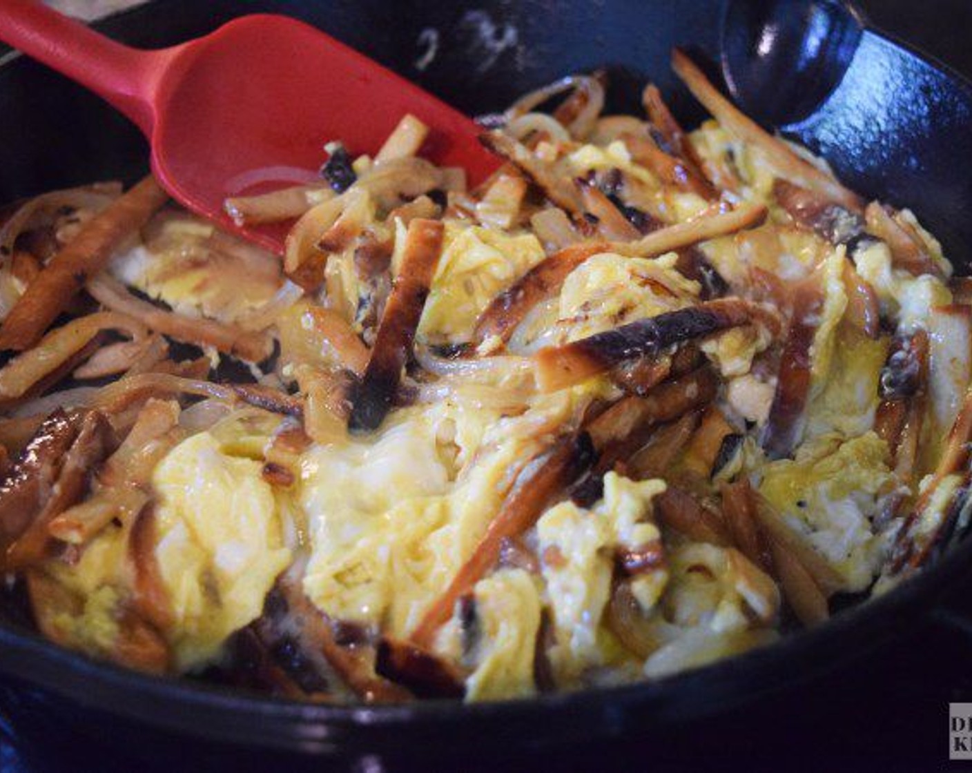 step 6 Turn the heat on the skillet down to low and scoot the tortilla strips to the outer edges of the skillet. Then, add Butter (1 Tbsp) to the skillet and then add the eggs, and cook them, stirring gently for about 1-2 minutes, until just set.