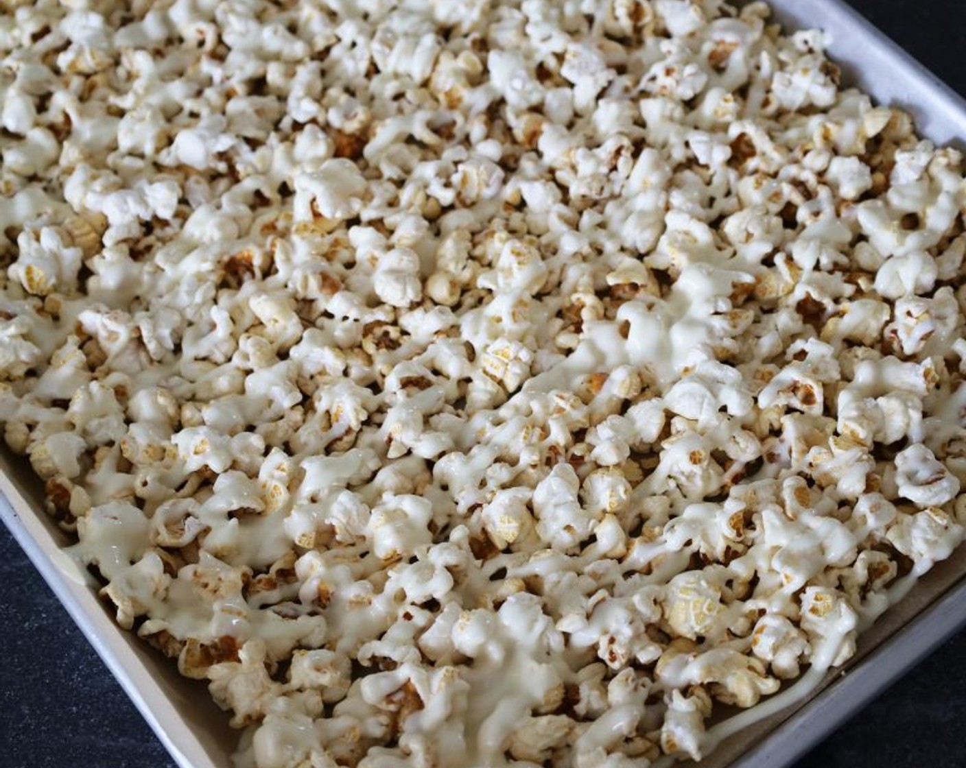 step 1 Line a sheet pan with parchment paper. Add Kettle Corn (8 cups) and spread it into one even layer.