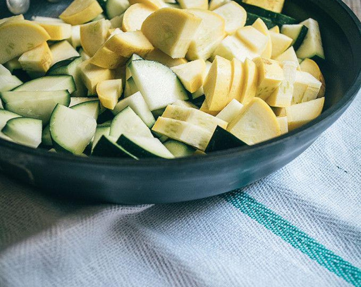 step 3 Slice Yellow Squash (2), Zucchini (1) and Cherry Tomato (1/2 cup). Add sliced squash and zucchini to medium pan.