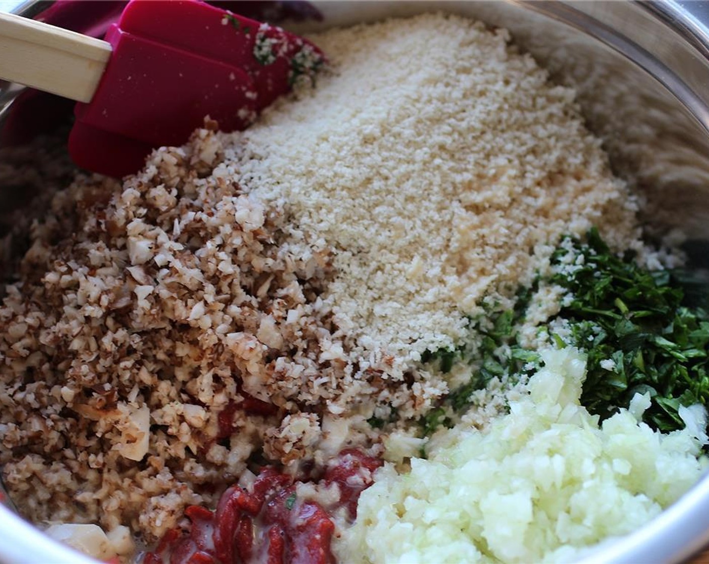 step 3 Add the onion, mushrooms, parsley, spinach, walnuts, Garlic (2 cloves), Nutritional Yeast (3/4 cup), Panko Breadcrumbs (1 cup), Lentils (2 1/2 cups), egg replacers, 2 tablespoons of Tomato Paste (4 Tbsp) and Kosher Salt (1 pinch) into a large bowl.