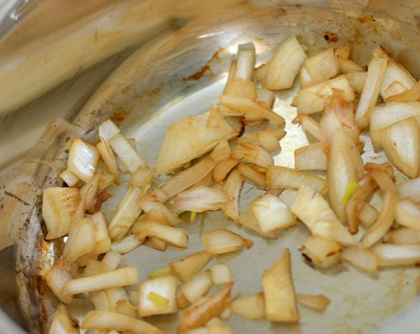 step 2 Saute the onion in a dry pan (or add pinch of Granulated Sugar (to taste) if you would like) for a minute until it starts to caramelize. Add Garlic (to taste) if you're using it and don't let it brown.