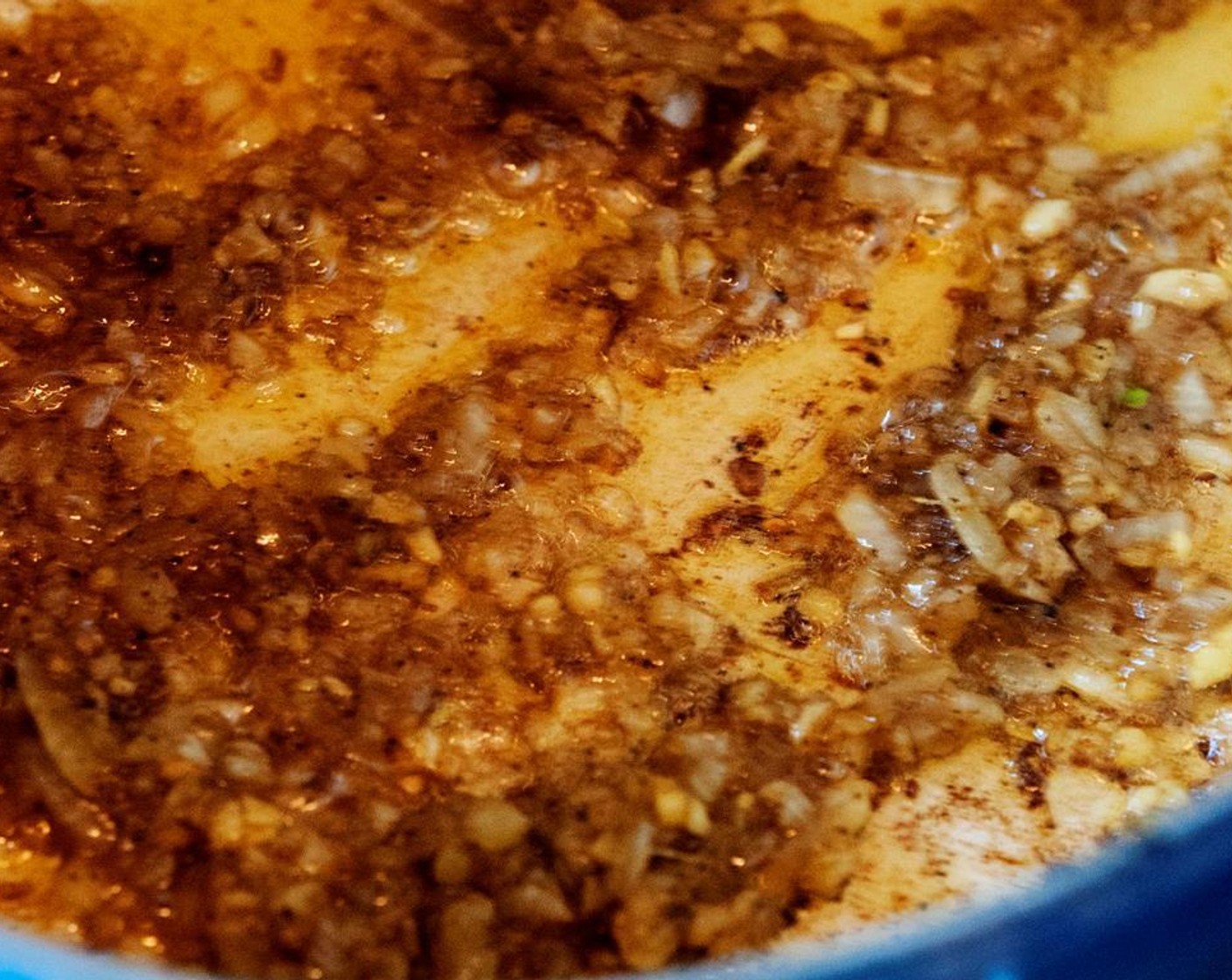 step 6 Reduce heat to medium and add Salt (1 tsp), Vegetable Oil (2 tsp), Garlic (5 cloves), Fresh Ginger (3 Tbsp), and Yellow Onion (1). Cook, stirring and scraping up browned bits with a wooden spoon, until onion is translucent.