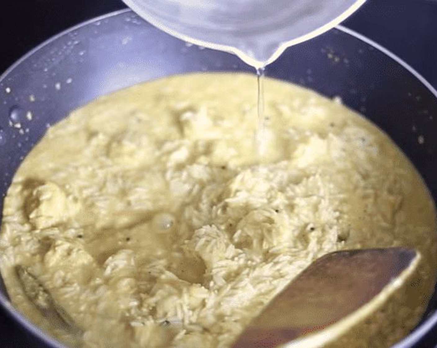 step 6 Drain the soaked rice and add to the pan. Mix gently to combine without breaking the rice, then add a bit of water until the rice is just covered. You want the total amount of liquid to be just around double the rice but no more.