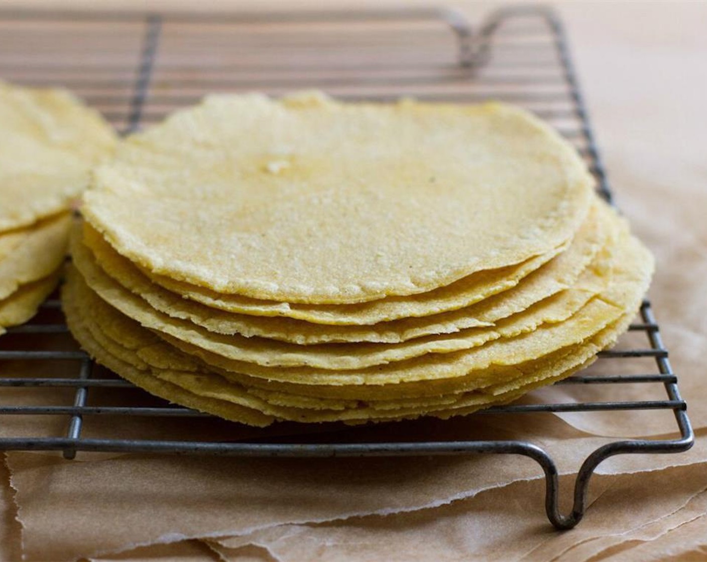 step 14 Stack the tortillas as they finish and keep covered with a towel or in a tortilla warmer. As the tortillas sit they should stay soft and easy to roll. If the tortillas are crunchy or tear when rolled, they were most likely overcooked.