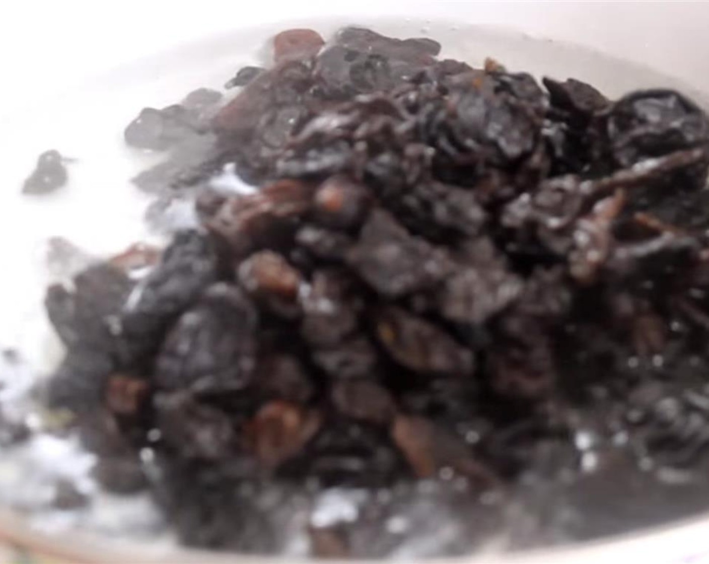 step 2 Pour the Water (1 cup) into a small pot and bring to a boil. Add the Raisins (1 cup) and boil for 8 to 10 minutes. You want about 3 tablespoon of the water remaining. Set it aside and let it cool completely.