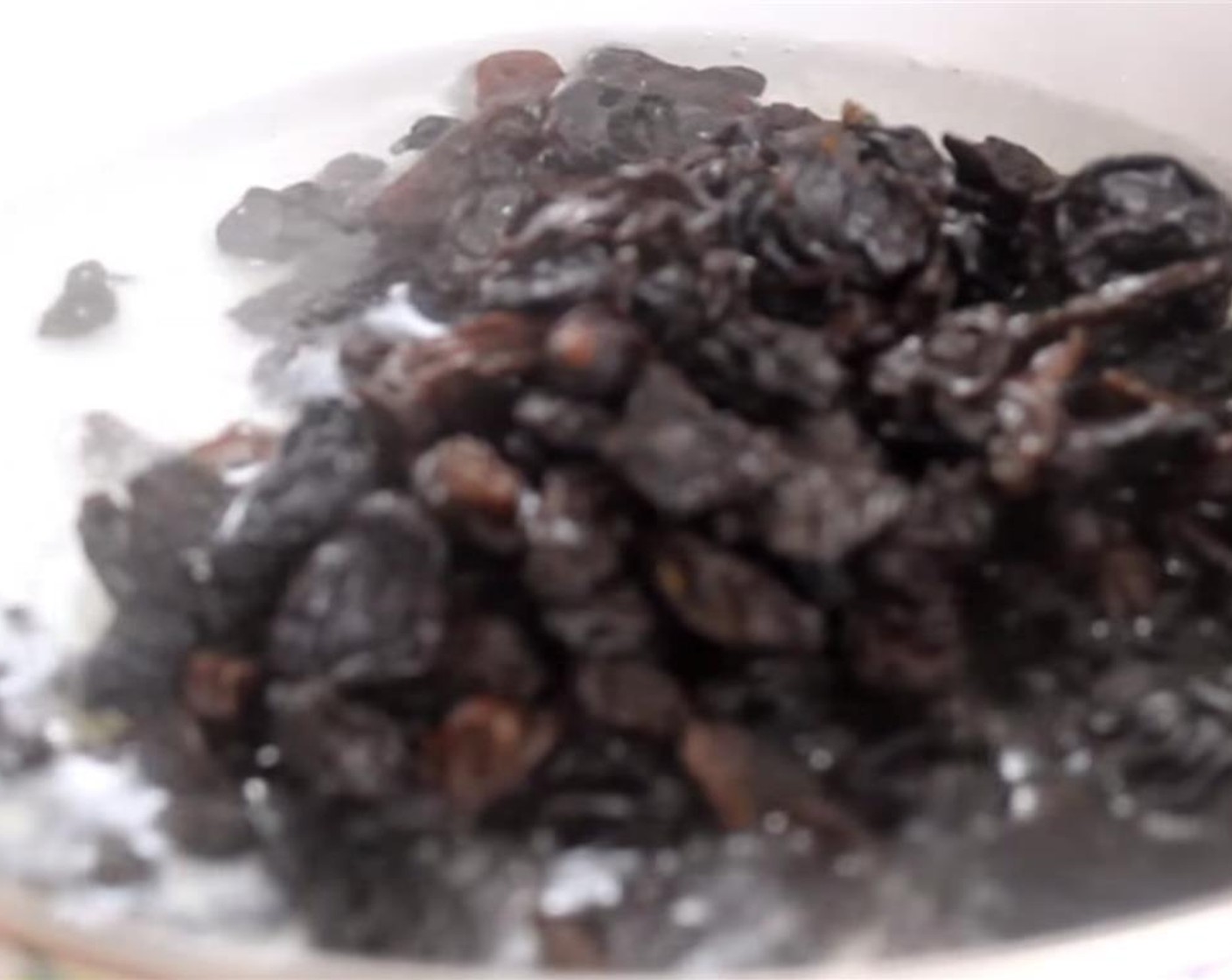 step 2 Pour the Water (1 cup) into a small pot and bring to a boil. Add the Sun-Maid Raisins (1 cup) and boil for 8 to 10 minutes. You want about 3 tablespoon of the water remaining. Set it aside and let it cool completely.
