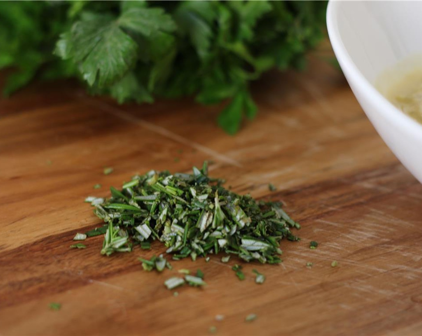 step 2 Strip the leaves from the Fresh Rosemary (2 sprigs) and chop them coarsely. Mince the Garlic (2 cloves).