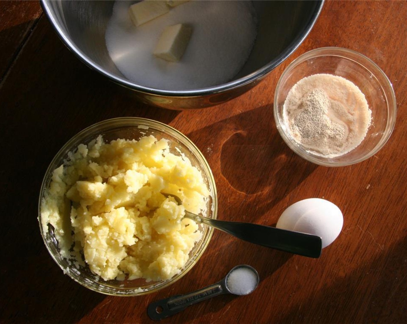 step 4 Cream 6 tablespoons of the Unsalted Butter (1/3 cup) and Granulated Sugar (1/2 cup) until fluffy in a medium bowl. Add the Salt (1/2 tsp) and Egg (1). Stir in the mashed potato and the yeast mixture.