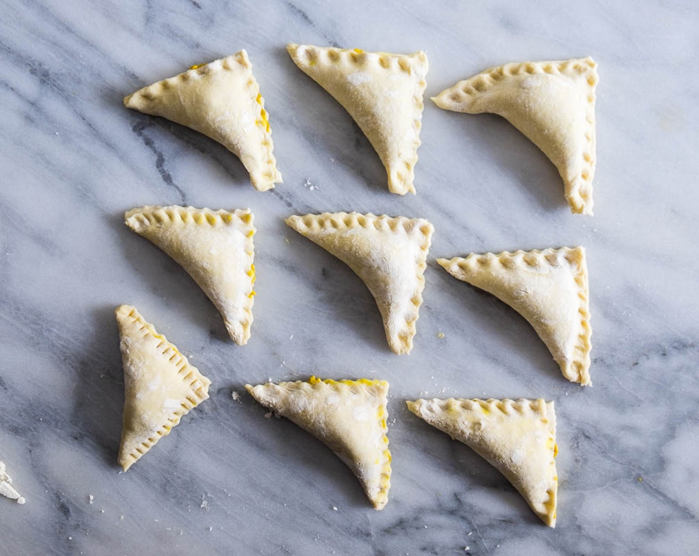 step 10 Press the edges together with your fingers to seal. Transfer the puffs to a baking sheet, two fingers apart between. Place the puffs into the fridge to let cool for at least 15 minutes while preheating the oven.