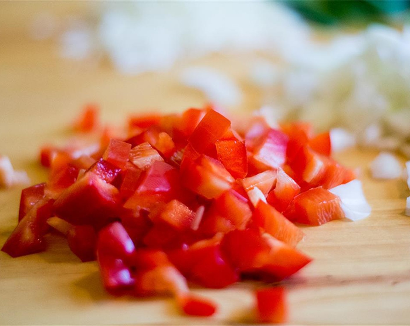 step 3 Meanwhile, heat a large skillet over medium heat, add Organic Butter (1 Tbsp), Sweet Onion (1 cup), Red Bell Pepper (1/2 cup), and Garlic (2 cloves). Sauté for 4-5 minutes or until onion is translucent.