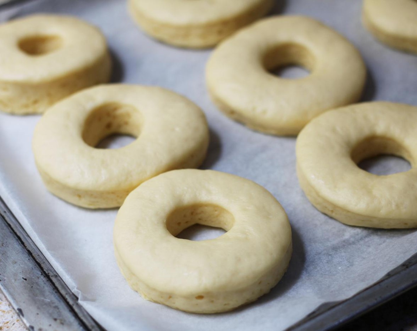 step 10 Set doughnuts aside in a warm place to double in size, around 45 minutes.