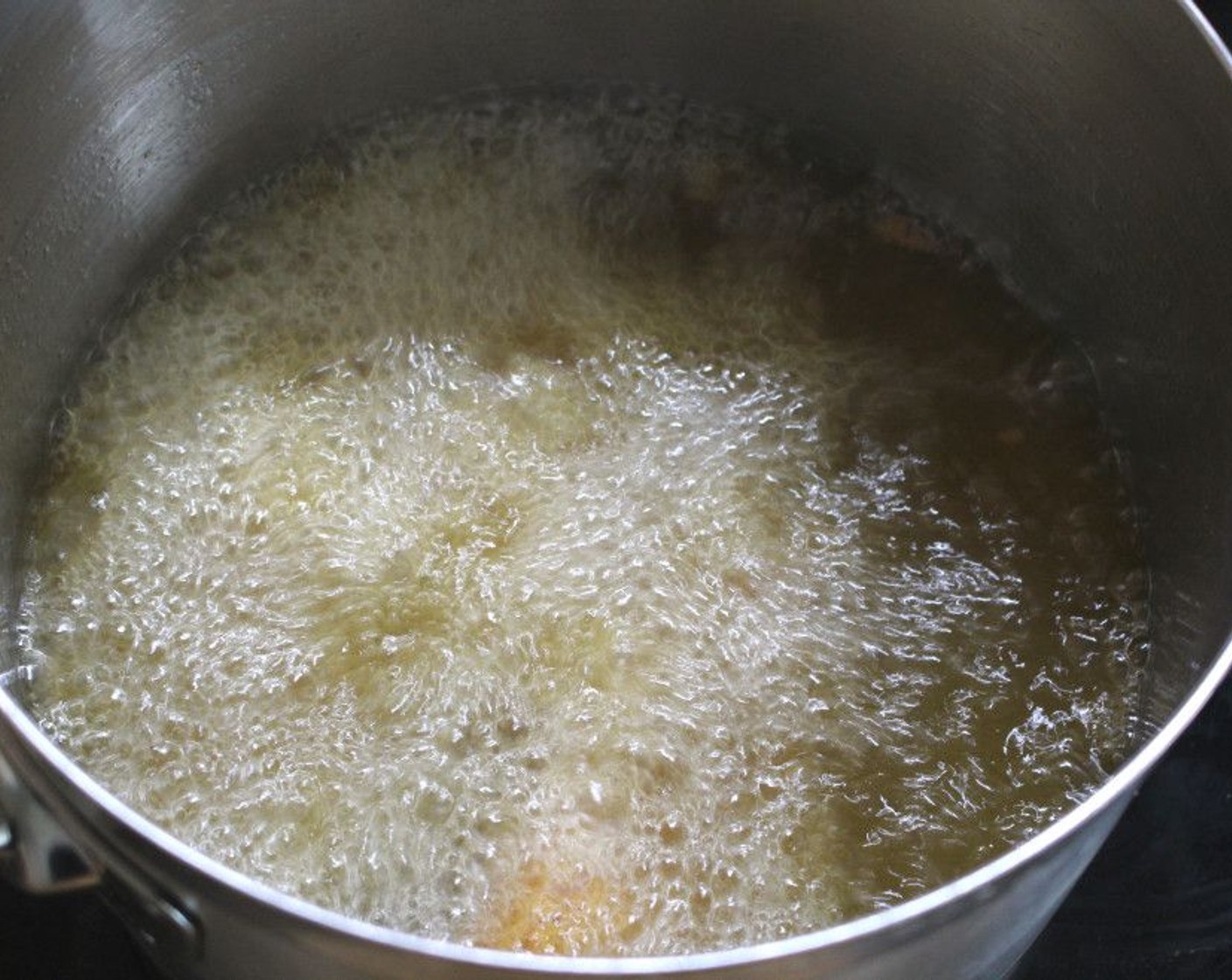 step 5 Fill a pot with enough Peanut Oil (as needed) to cover the fish, and heat to 375 degrees F (190 degrees C).