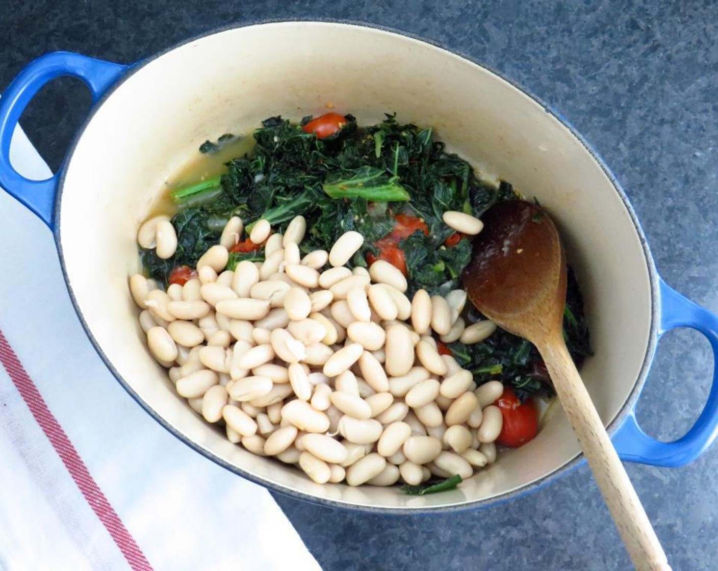 step 3 Stir to combine. Cover tightly with a lid and cook for 3-4 minutes, until tomatoes start to split and give up their juices. Stir in the Canned Cannellini White Kidney Beans (2 cups), remaining vegetable stock, Salt (to taste), and Ground Black Pepper (to taste).