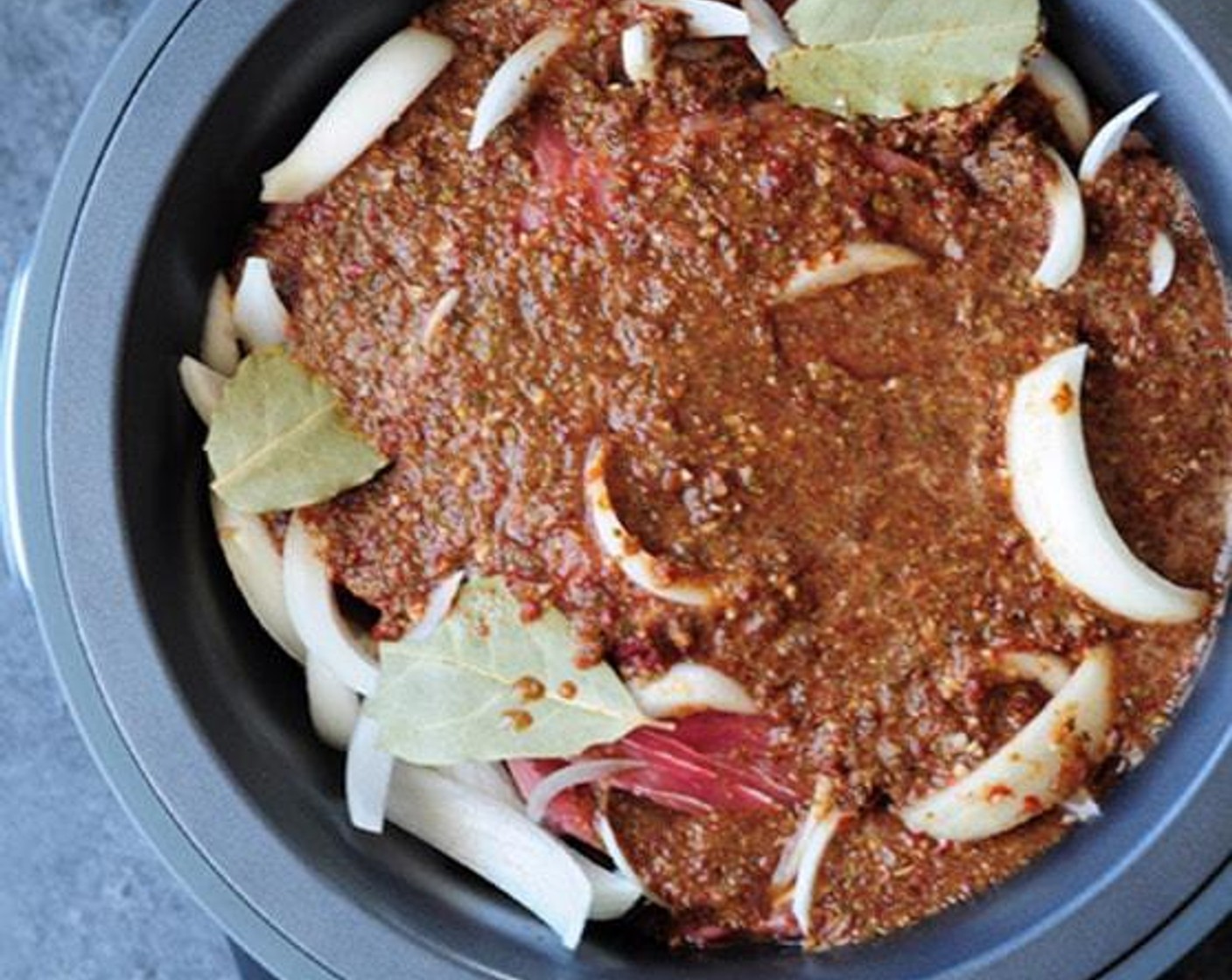 step 3 Pour the mixture over the beef. Add in Bay Leaves (3).