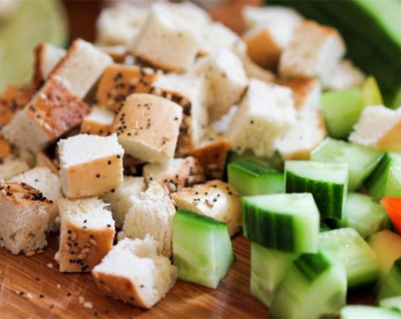 step 2 Dice Bagel (1) into ½-inch cubes. Toss bagel cubes in Extra-Virgin Olive Oil (1 Tbsp) and bake on a cookie sheet in the oven until toasted.