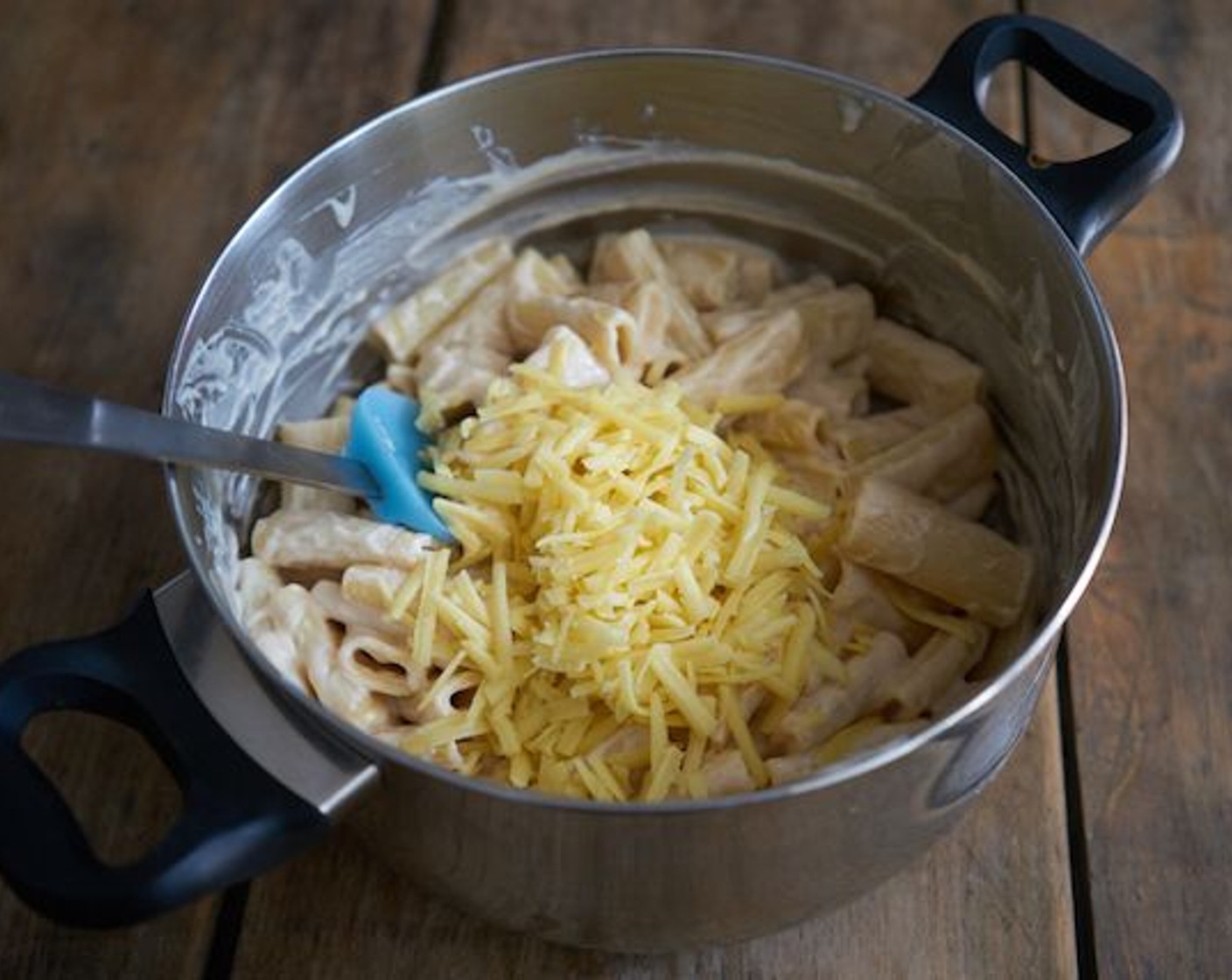 step 11 Add 1 3/4 cups of the grated cheese and incorporate.