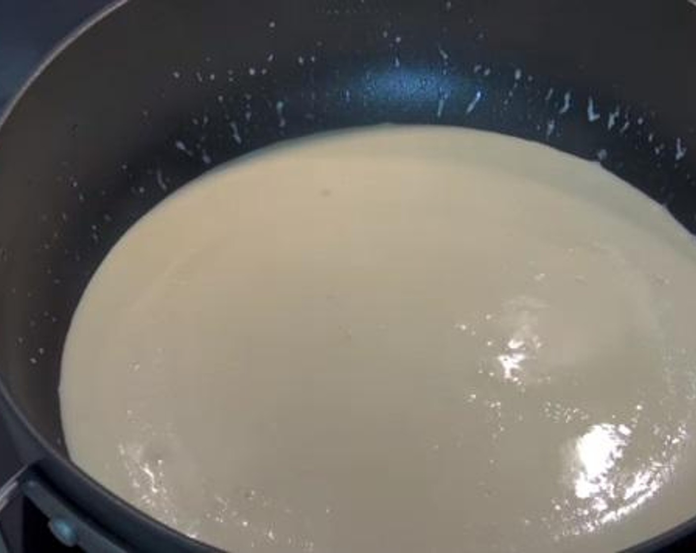 step 2 In a saute pan over medium heat, cook together the Butter (2 Tbsp) and Garlic (4 cloves). Then add in the Whipping Cream (1/2 cup) and allow it to simmer for 5 minutes.