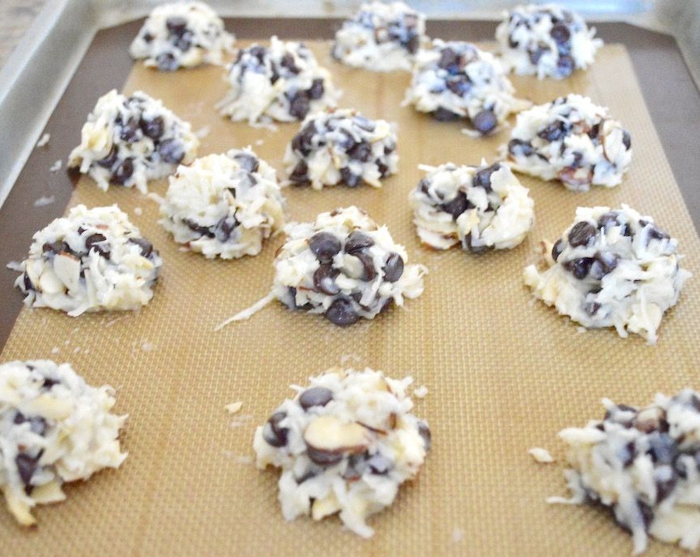 step 3 Use a 1 1/2-inch cookie scoop to scoop perfect, tightly packed little mounds of the batter right onto the cookie sheet. These do not spread that much and are fairly small, so all of them can be squeezed on one sheet.