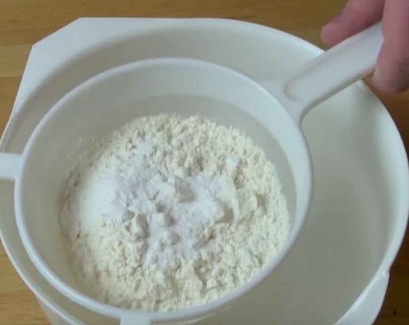 step 2 Sift it together for two or three times just to make sure the baking powder is completely incorporated into the flour and there are no lumps. Store the self raising flour in a clean container until the next time you need it.