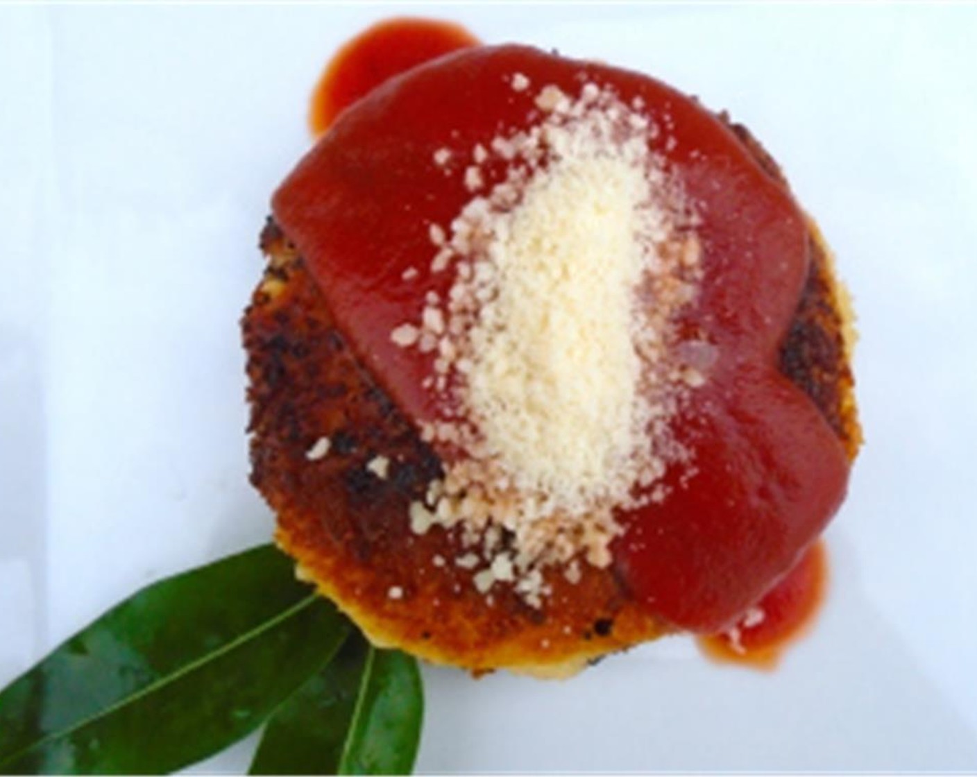step 8 Nape with Tomato Sauce (4 Tbsp) and sprinkle with grated parmesan cheese.
