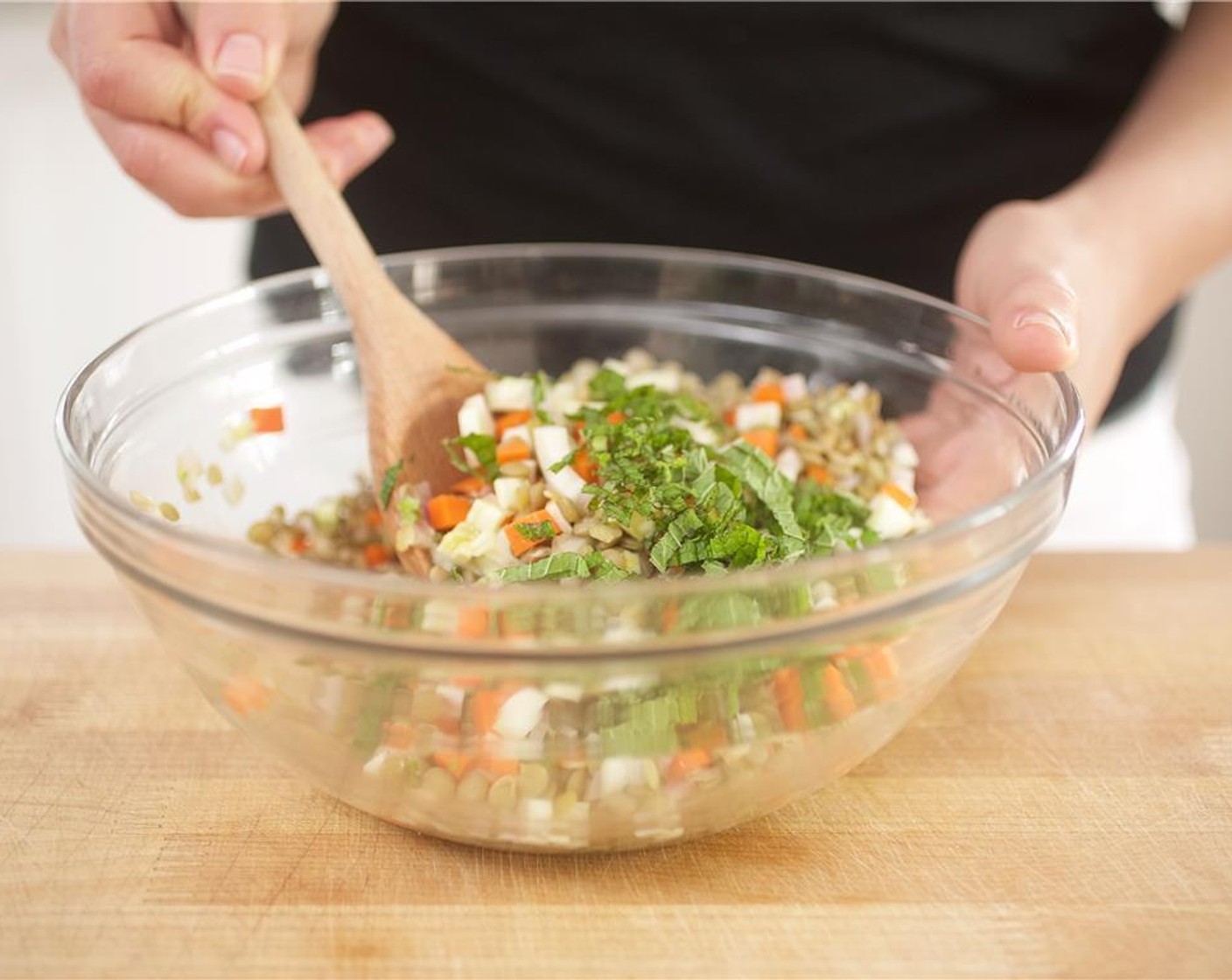 step 8 In a large bowl, toss together the lentils, fennel, carrots and shallots. Add the lemon vinaigrette, mint, and Salt (1/4 tsp) and Ground Black Pepper (1/4 tsp). Toss until fully incorporated. Crumble half of the Goat Cheese (2 Tbsp) over the lentil salad.