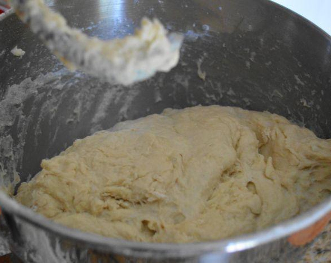 step 3 Slowly and gradually add in the High-Gluten Bread Flour (8 cups) until it is all incorporated. Let the dough hook continue working until the dough is elastic and starts to pull away from the sides of the bowl. Then it's done.