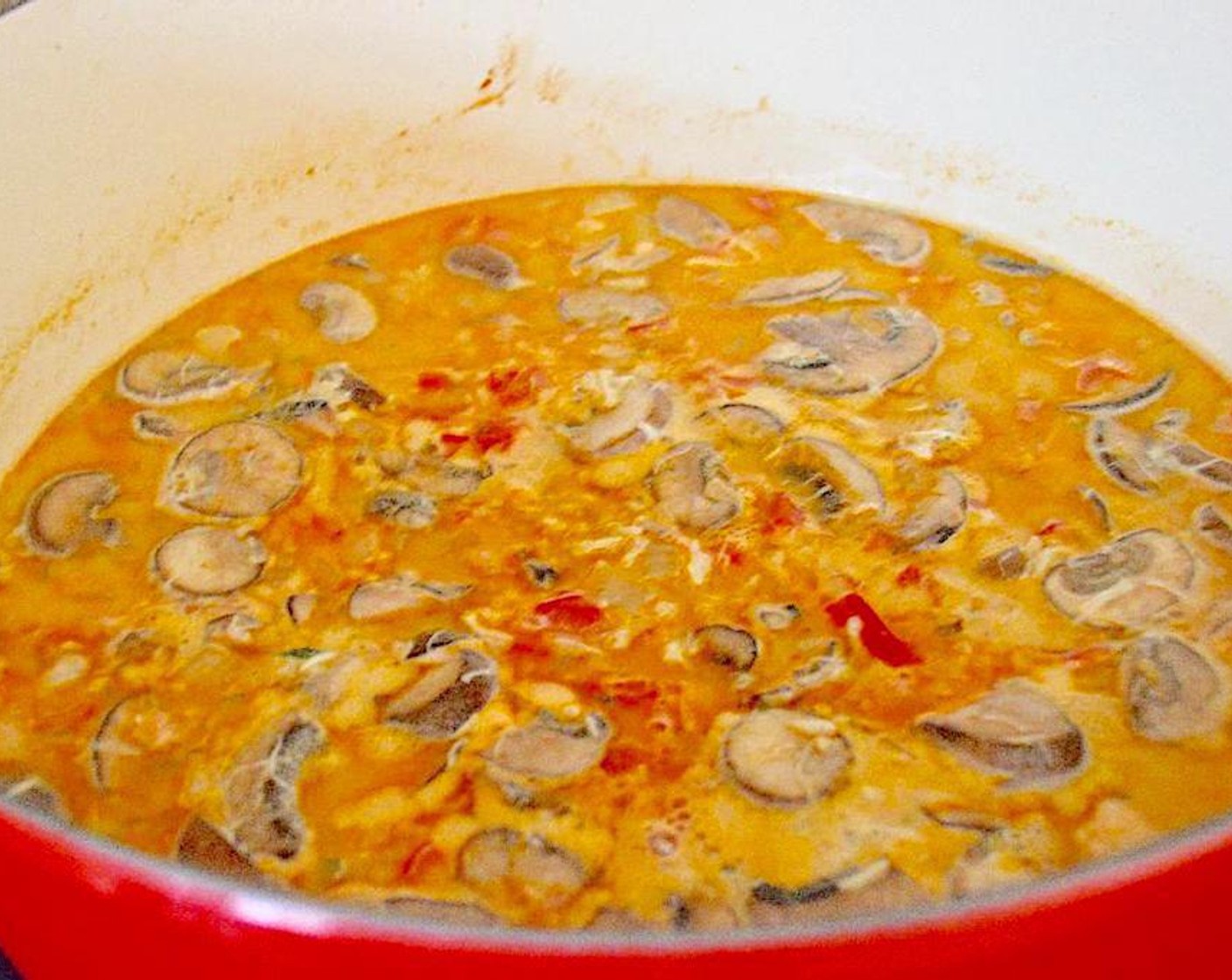 step 4 Finally, pour in the Chicken Stock (4 cups) and Heavy Cream (1/2 cup). Give it all a good stir and turn the heat to low. Let the soup gently simmer for 45 minutes to an hour to really thicken and develop flavor. Stir it occasionally while it does.