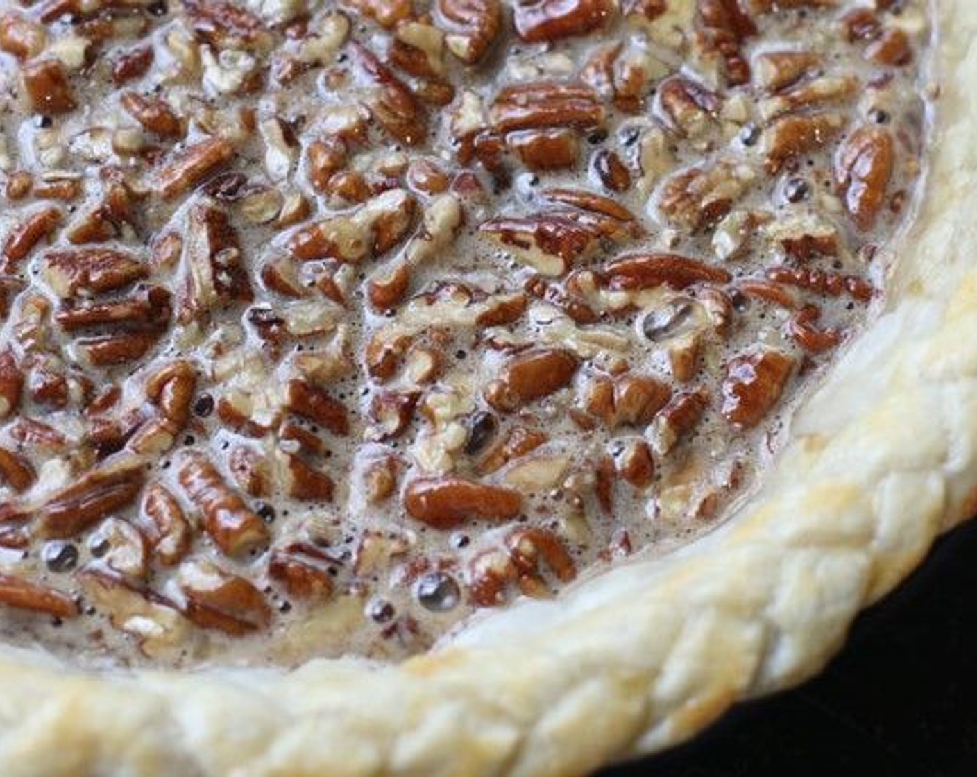 step 21 Pour the pecan mixture over the back of a spoon into the warm pie shell (this will prevent your crust from cracking).