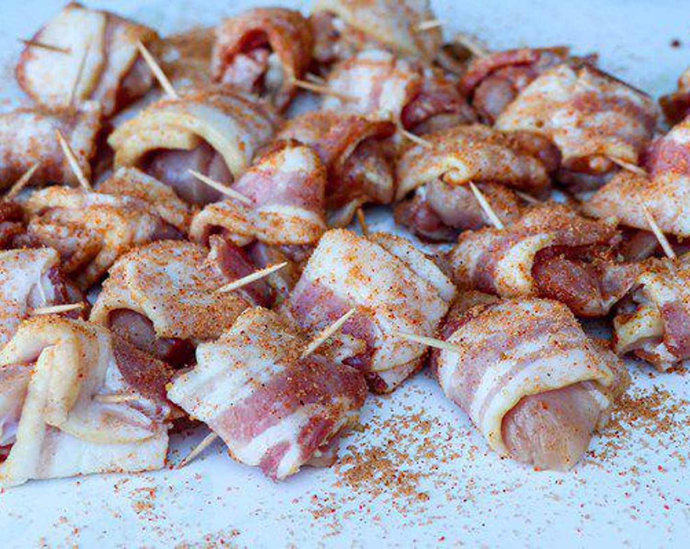 step 3 Combine the Brown Sugar (1/2 cup), Barbecue Rub (2 Tbsp), Cane Sugar (2 Tbsp) and Cayenne Pepper (1/2 tsp) in a small bowl and sprinkle over all sides of the bacon-wrapped chicken.
