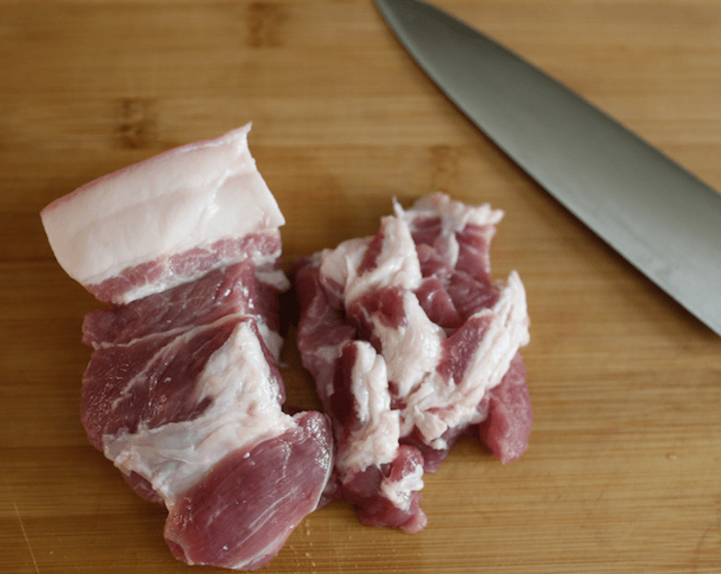 step 1 Slice Pork (3.5 oz) into large pieces.