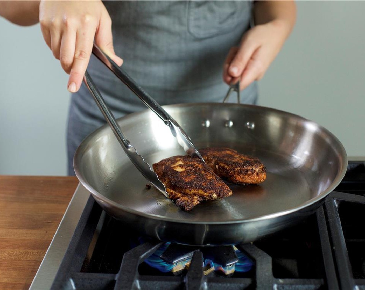 step 7 In a medium sauté pan over medium high heat, add Olive Oil (1 Tbsp). When the pan is hot, add the chicken and cook for 4 minutes on each side.